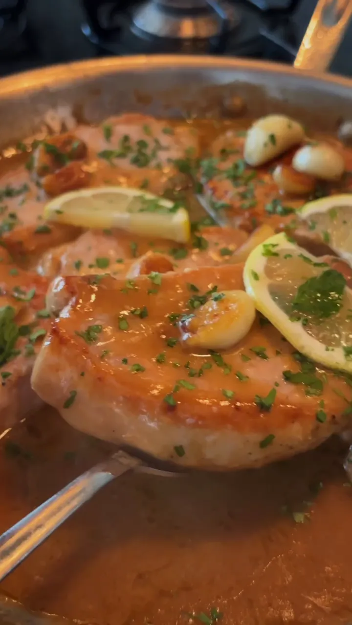 A golden pan-cooked dish finished with lemon and herbs